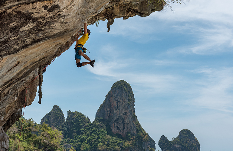 A rock climber hanging on rock (c) Hu Chen